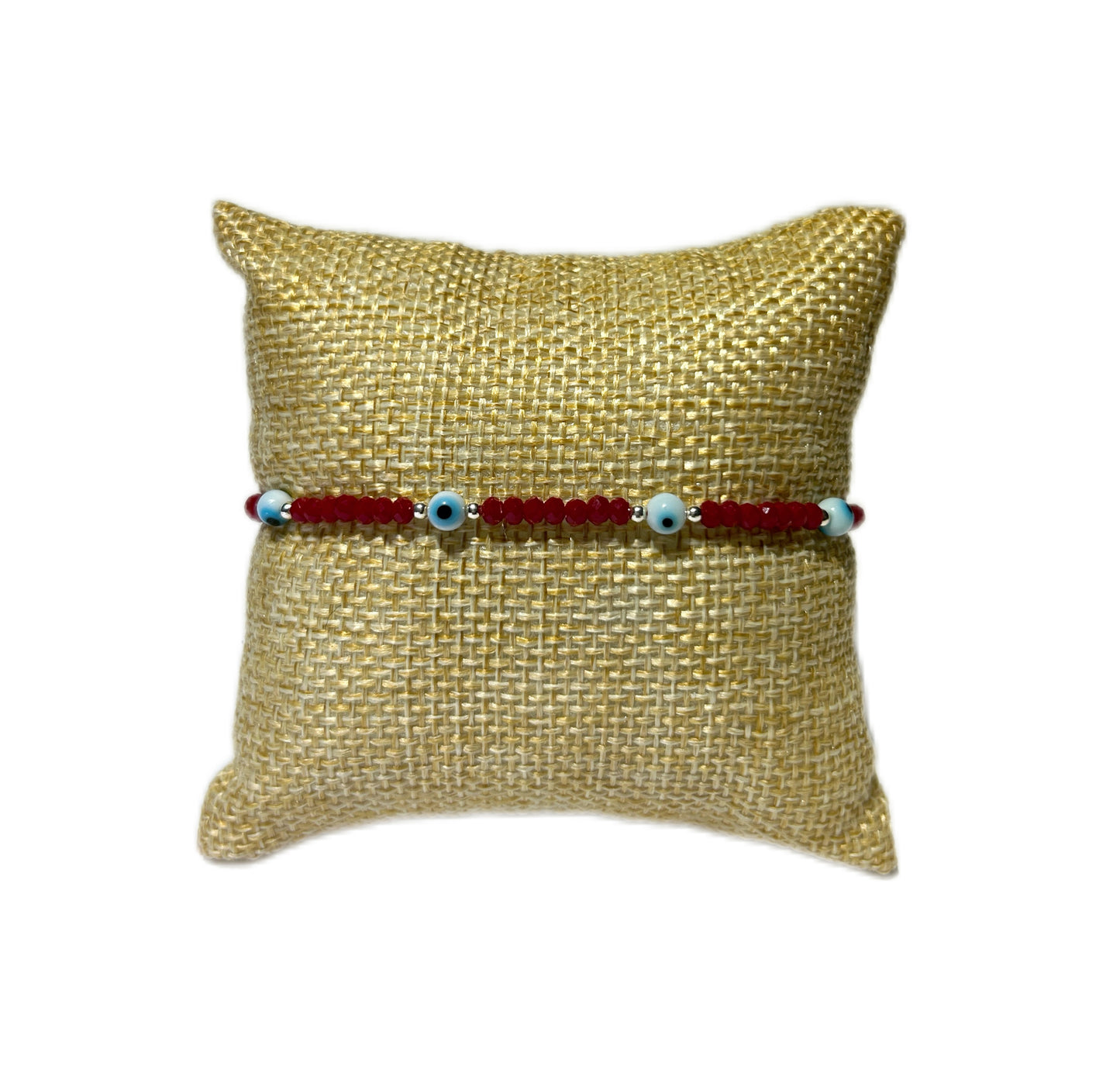 Pulsera de ojitos blancos y plata
