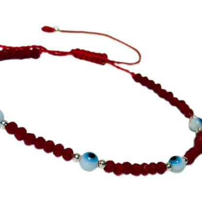 Pulsera de ojitos blancos y plata